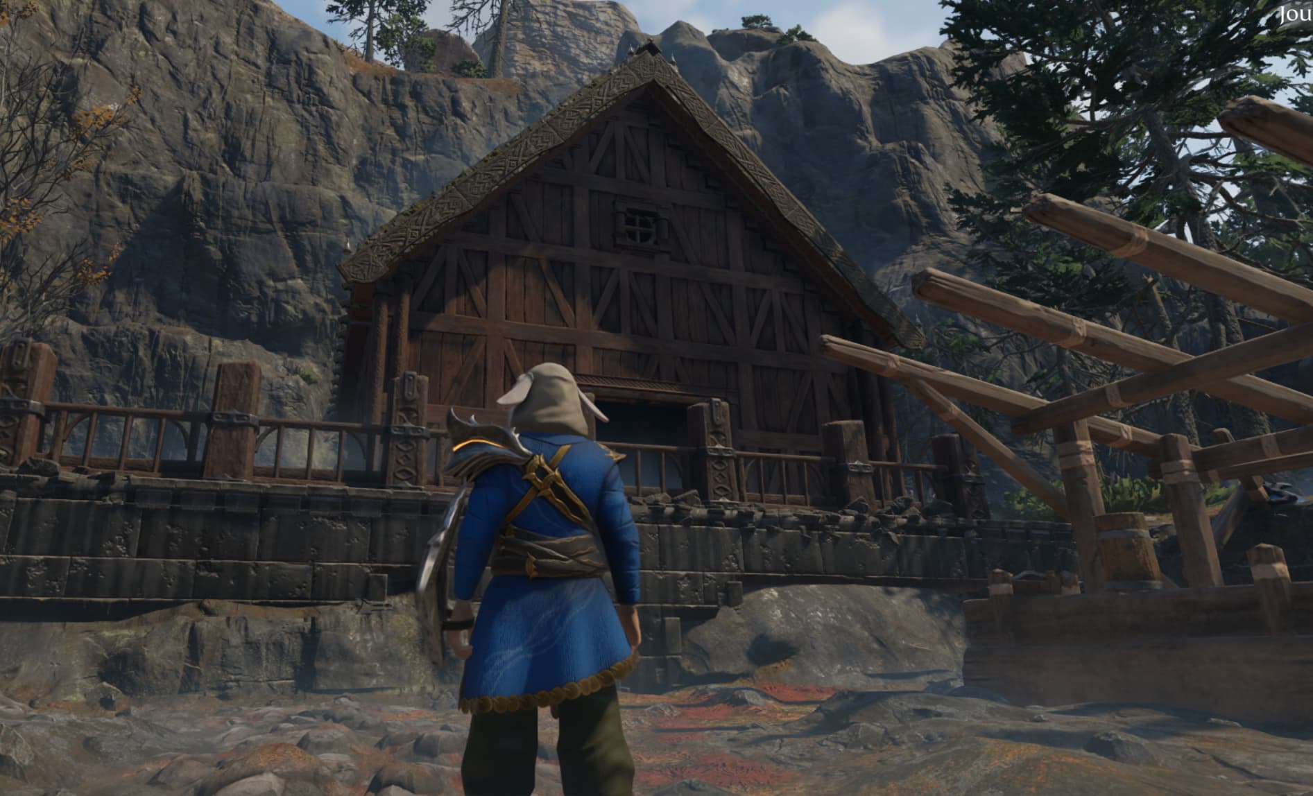 A screenshot from Enshrouded showing readers a brown wooden farmhouse, where they can find the Fluffy Pants.