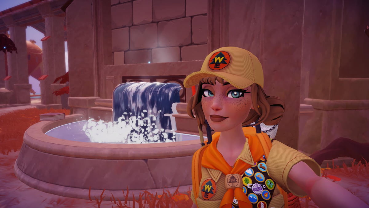 The player taking a picture with a fountain in Disney Dreamlight Valley. 