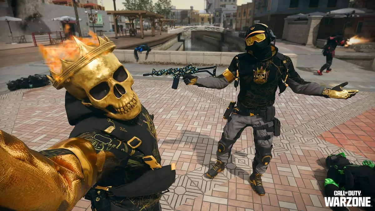 Two operators, one with a hood and ski goggles and one with a skull and flaming crown, pose for the camera.