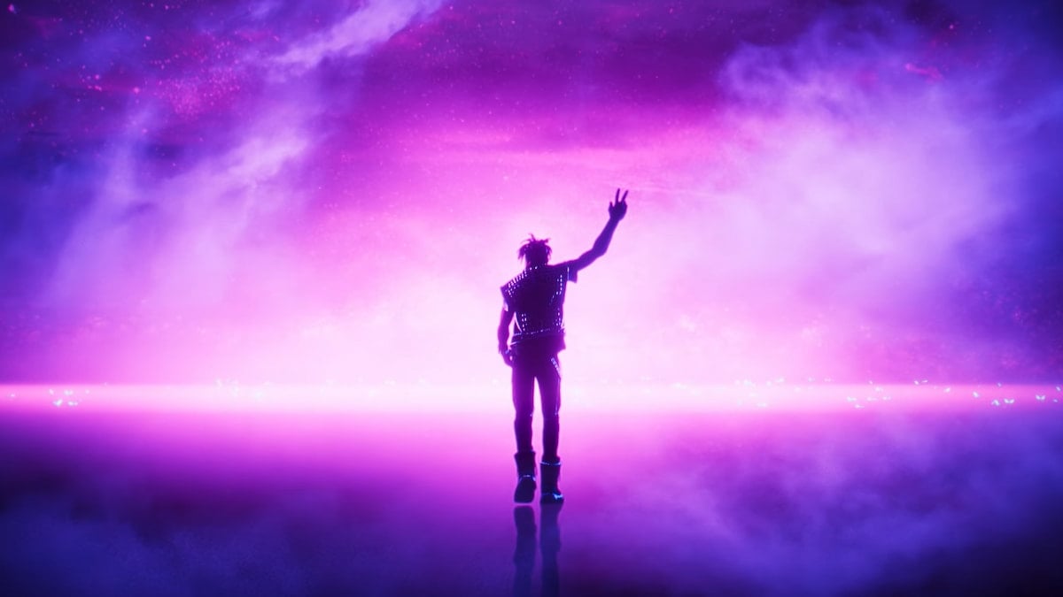 Juice WRLD walking away towards a purple sky while holding up his hand in a peace sign in Fortnite Remix.