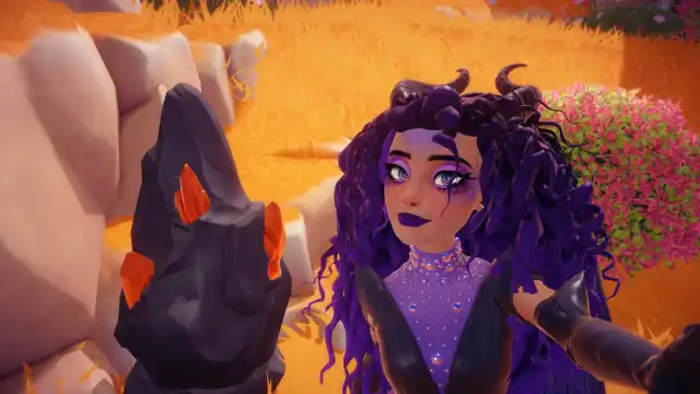 A player with curly purple hair and black horns taking a picture with a black Magma rock node with orange Gems sticking out of it in Disney Dreamlight Valley.