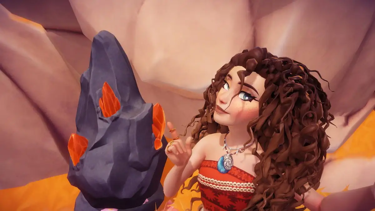 A player with curly brown hair pointing at a black rock node with orange gems sticking out of it in Disney Dreamlight Valley.