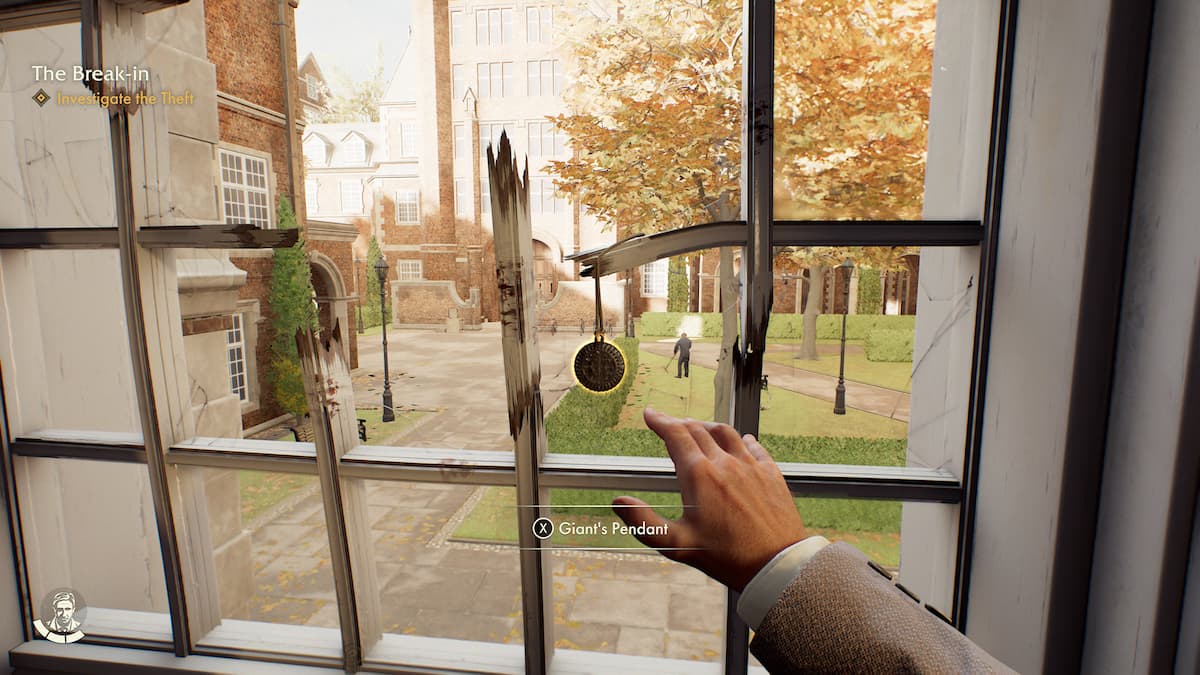 a pendant is hanging from the broken window