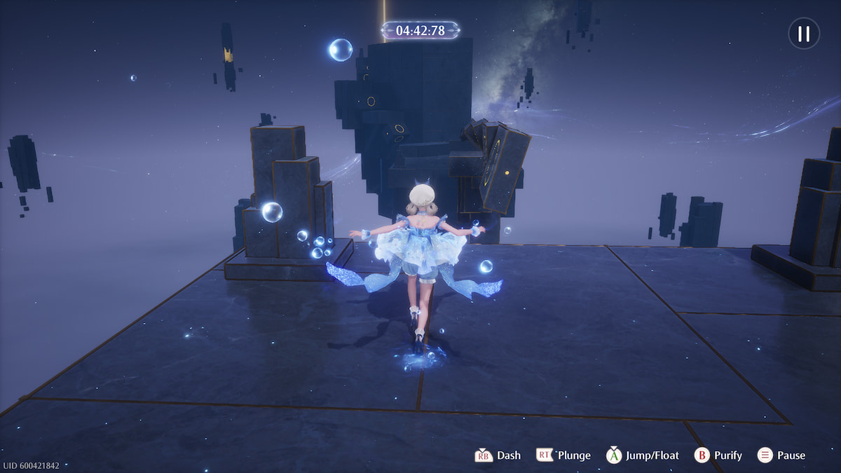 Nikki in her blue floating dress jumping on a platform