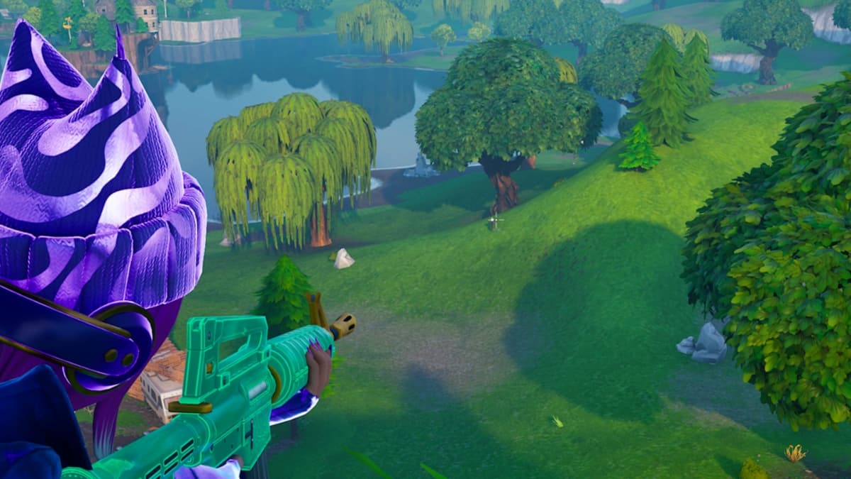 Character in purple beanie aiming at an enemy in the grass hills