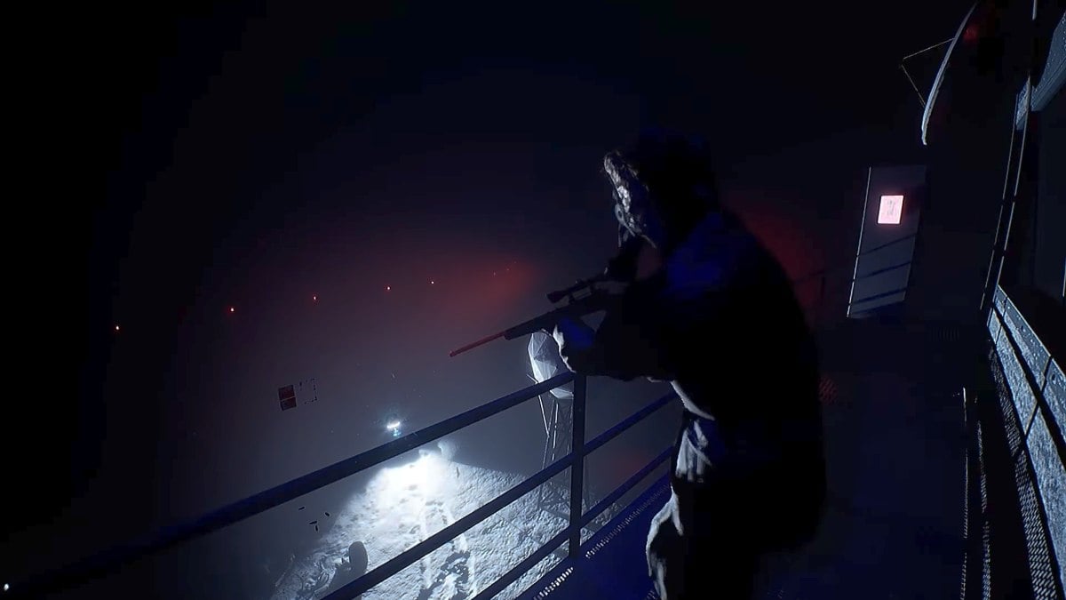 A sniper wearing a mask, looking out for monsters over a railing onto a snowy, lit area underneath