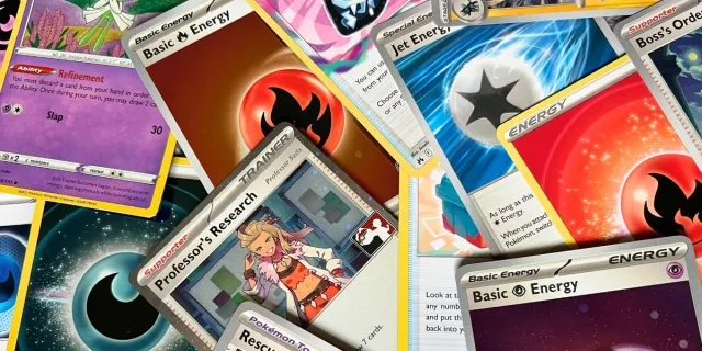 Colourful Pokémon cards scattered in a pile on top of one another.