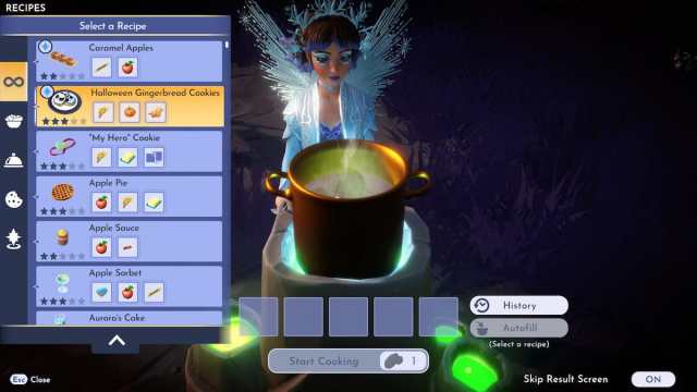 A player looking at a cooking pot preparing to make Caramel apples and Halloween Gingerbread Cookies.