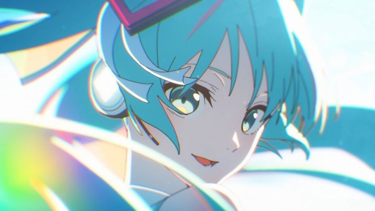 Hatsune Miku smiling and looking back over her shoulder with her blue pigtails blowing in the wind.