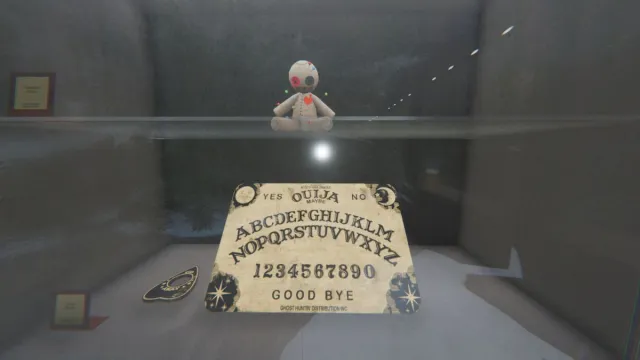 Voodoo Doll and Ouija Board in the lobby display case in Phasmophobia.