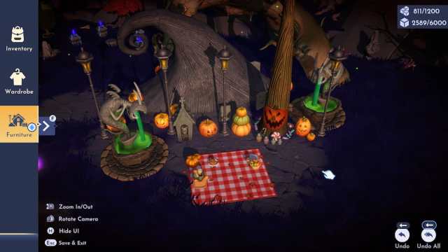 A picnic space with yellow lights, orange pumpkins, a massive black spiral hill, and two spitting green fountains in Disney Dreamlight Valley.