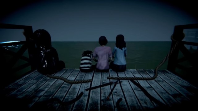 The back of three children on the edge of a bridge, looking out into the ocean