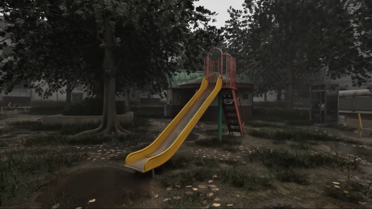 An establishing shot of the slide in the park with a tree in the background in Cursed Digicam