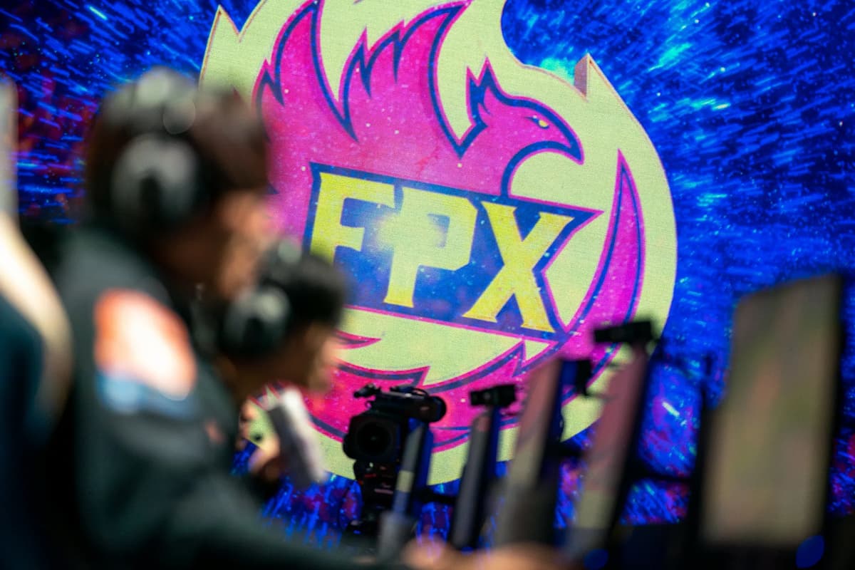 An image showcasing FPX logo at Worlds 2019 stage.