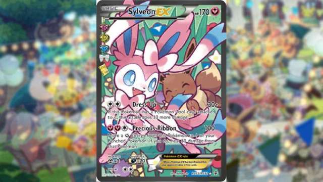 An image of a Sylveon Pokemon Trading card, that features the eeveelution getting bit by an Eevee.