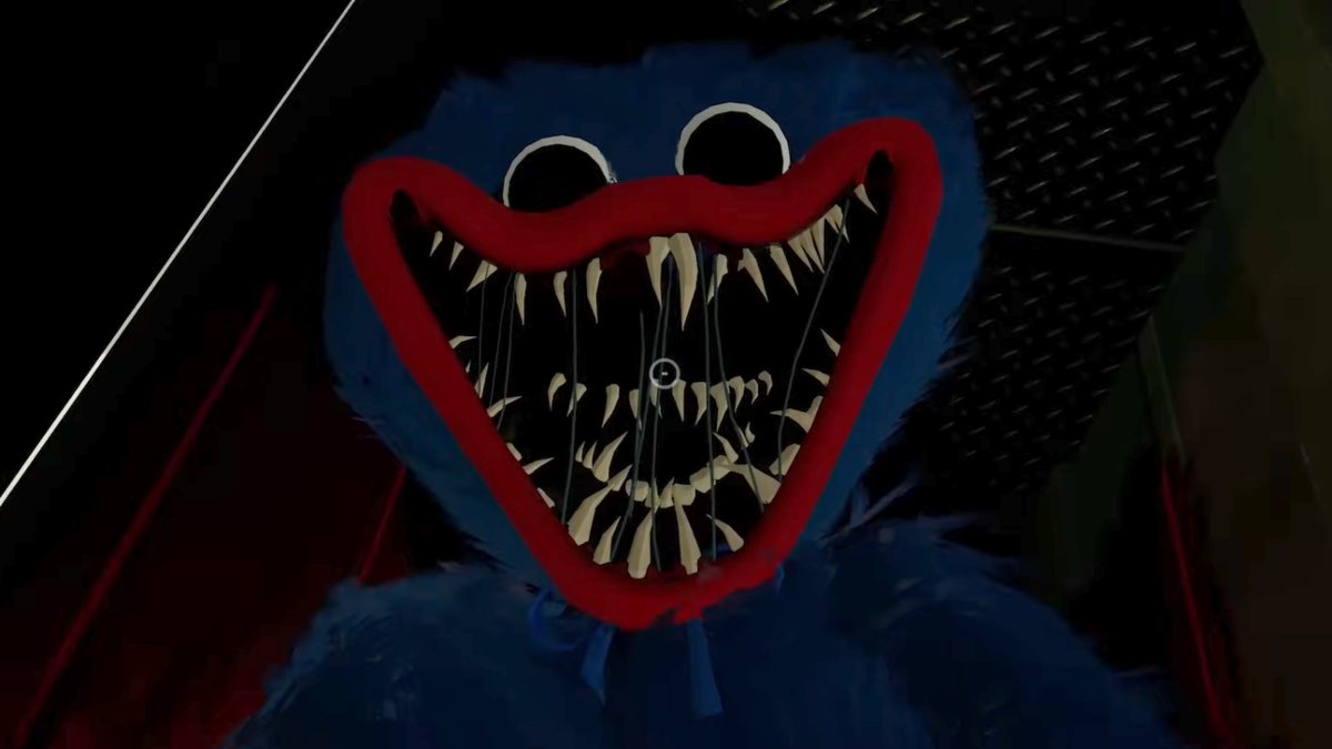 A close up of Huggy Wuggy's face in one of the death jumpscare game over screens