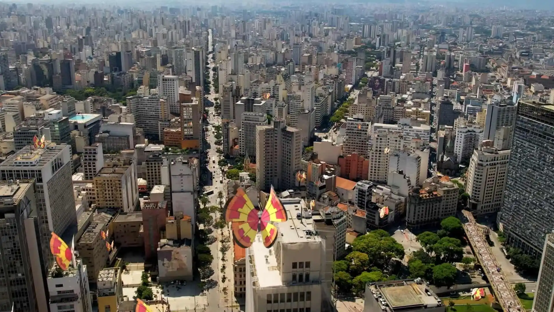 A butterfly Pokemon flutters above a busy city.