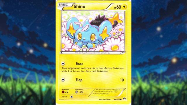 An image of Shinx in a Pokemon Trading Card, where the small electric blue puppy is resting in a field of flowers.