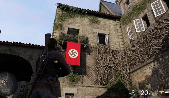 A screenshot from Sniper Elite Resistance showing Harry looking up at open windows on a stone building. This shows readers where to find Vertigo's office