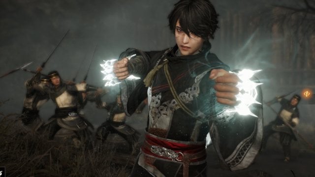 Dynasty Warriors Origins protagonist with glowing gauntlet weapons ready to fight