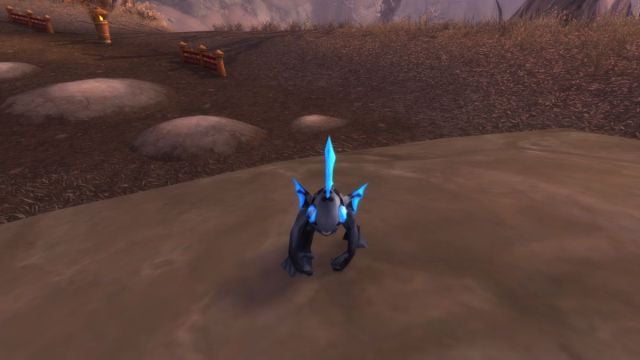 Murloc battle pet on the ground in World of Warcraft.