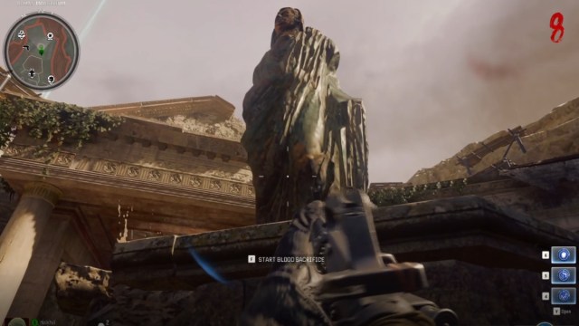 The second Statue with head on top and a prompt below it to start the Blood Sacrifice in Black Ops 6 Zombies The Tomb map