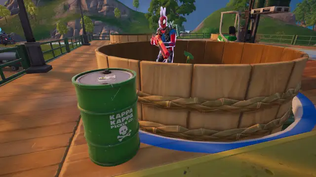 Spider-Punk standing by a green barrel in Fortnite.