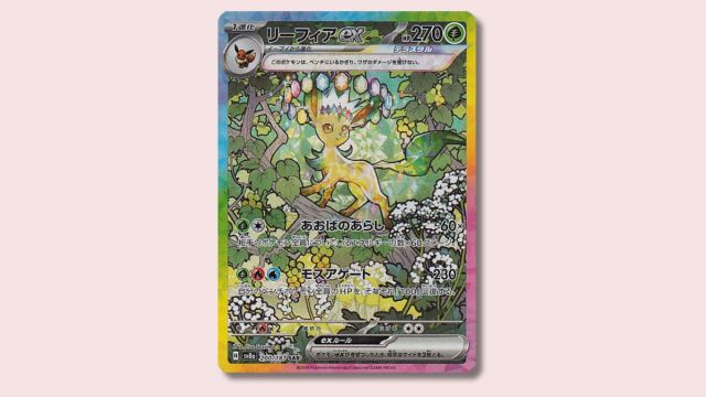 Leafeon Pokémon card on a pink background.