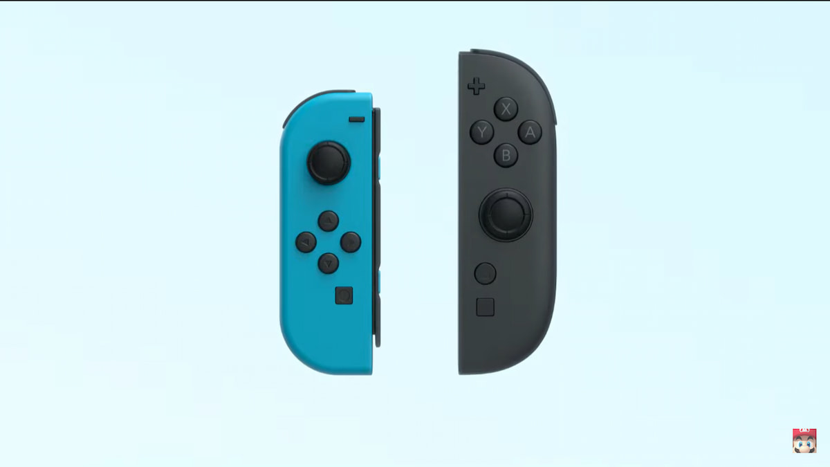 A blue Nintendo Switch Joy-con on the left and a black Switch 2 Joy-con on the right.