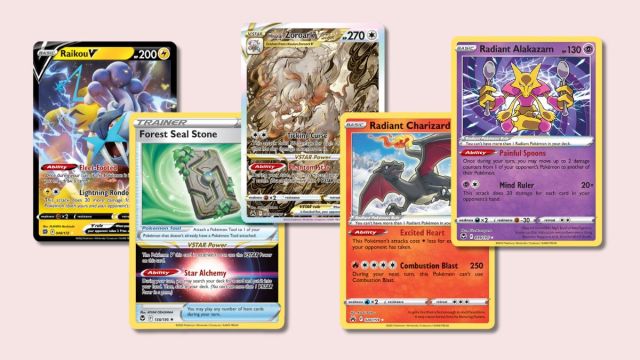 Raikou V, Forest Seal Stone, Hisuian Zoroark VSTAR, Radiant Charizard, and Radiant Alakazam Pokémon cards on a pink background.