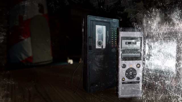 A Sound Recorder being held by a player inside Point Hope in Phasmophobia.