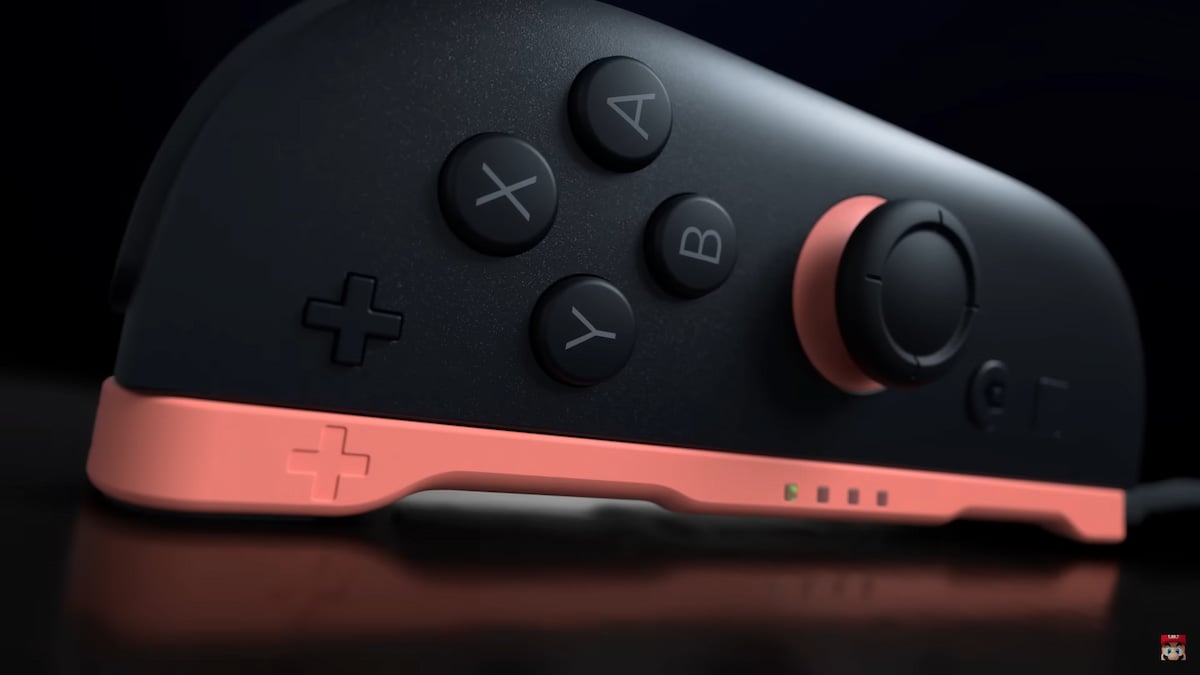 Switch 2 JoyCon with a red dock-like apparatus that may make it perform like a mouse