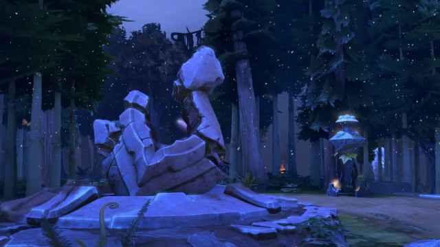 A ruined shrine lying crumbled in a forest with a statue full of eyes standing beside it in Dota 2.