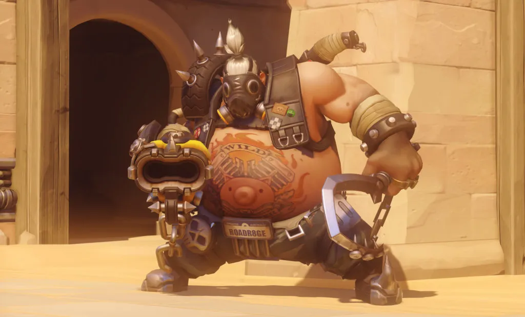 Roadhog from Overwatch posing for the camera with his Scrap Gun and Hook.