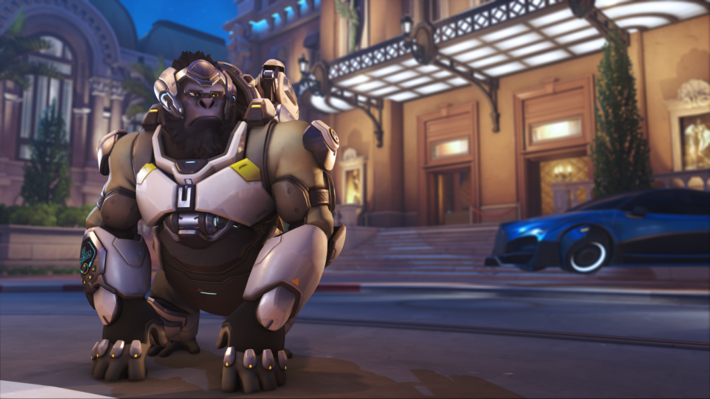 Winston, a large ape, poses squinting outside a city in Overwatch 2.