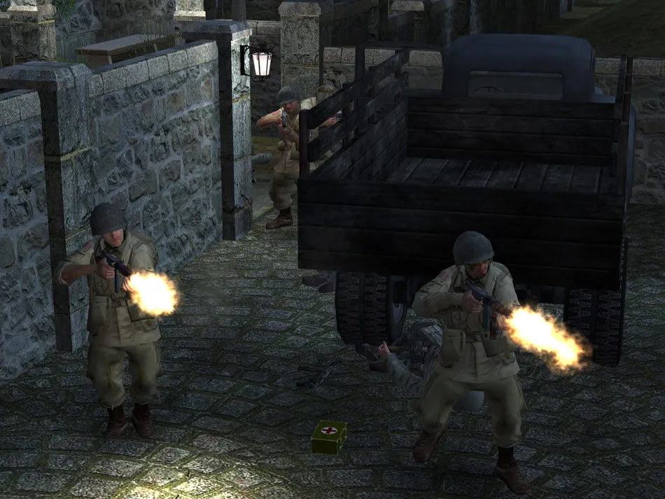 two soldiers firing with one behind the vehicle.
