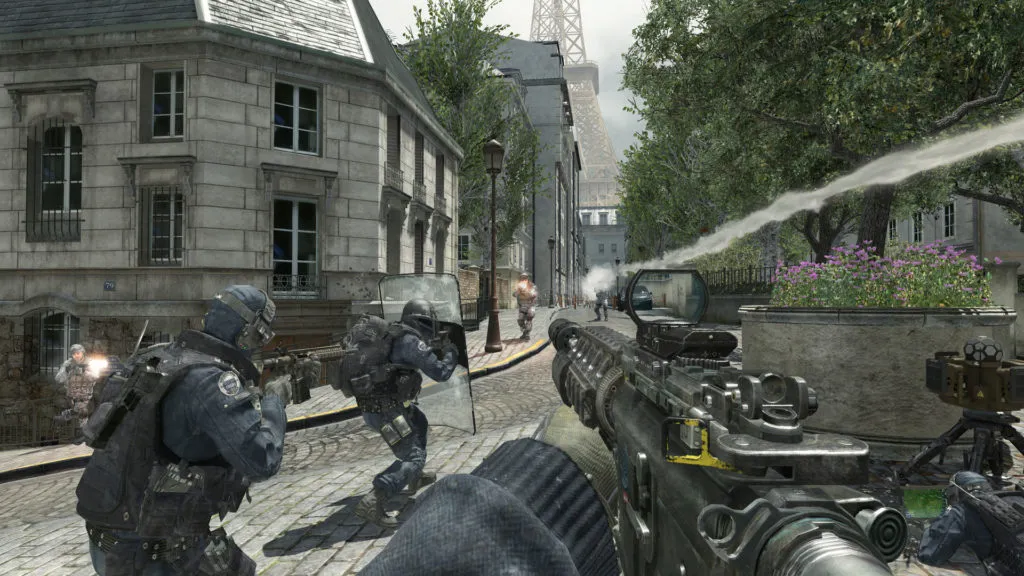 first person in-game view of Call of Duty: Modern Warfare 3 firing your automatic weapon with a rocket overhead