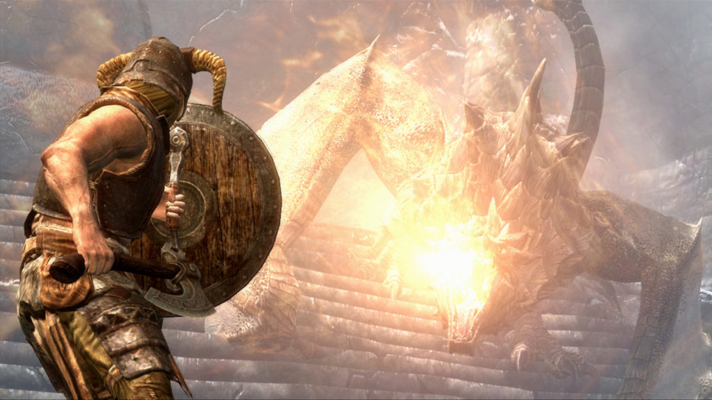 the dragonborn wearing a helmet and hide armour raises a shield to protect from a dragon's flames