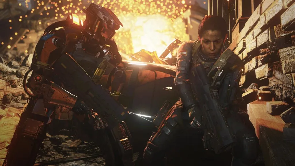 A human soldier and robot soldier take cover as a building explodes in Infinite Warfare.