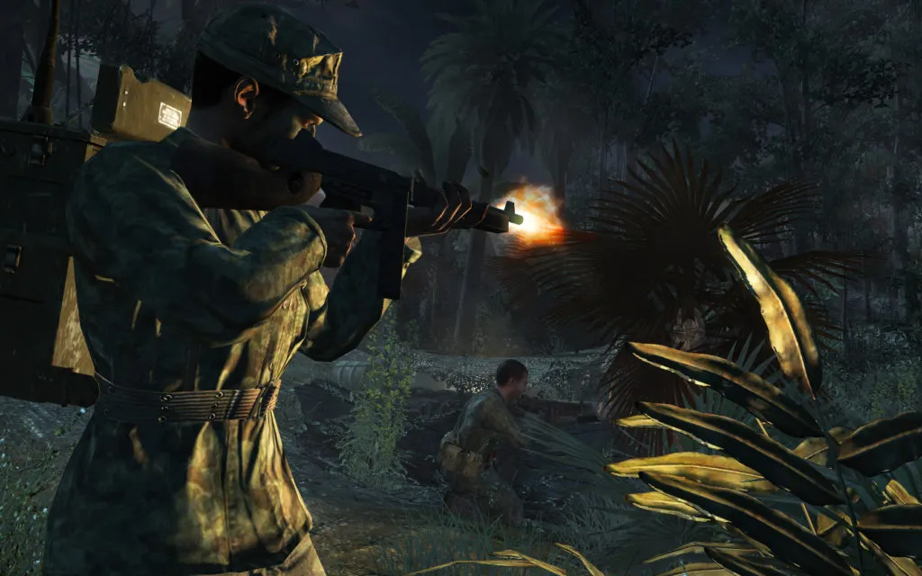 Soldiers fire through the treeline at zombies in Call of Duty: World at War.