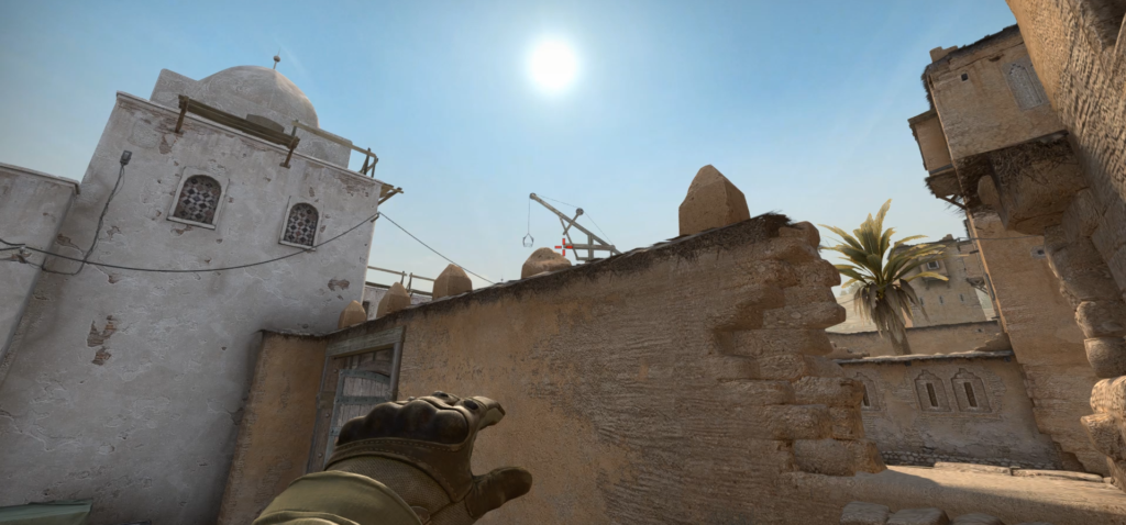 A CS:GO CT player outside window at B, preparing to throw a smoke towards tunnel on Dust 2.