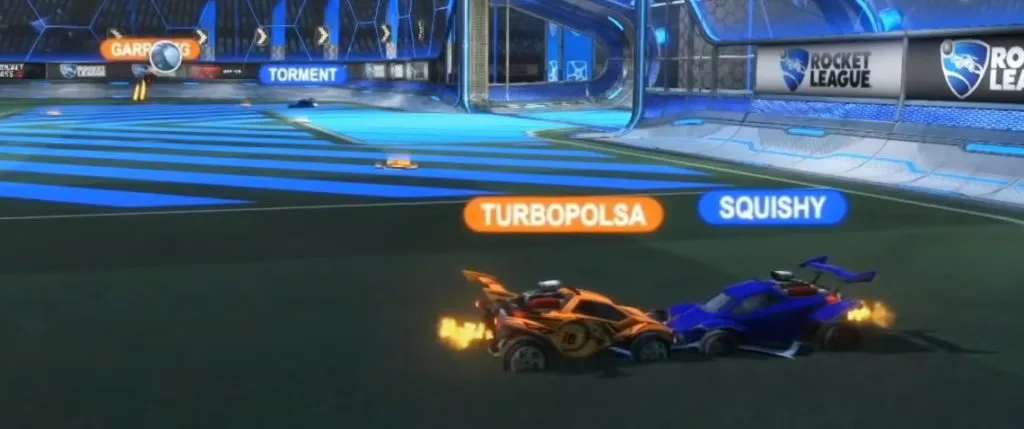 Two Rocket League players driving into each other and committing to the Rule 1