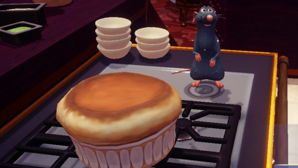 Remy stands next to a fully-cooked souffle in Disney Dreamlight Valley.