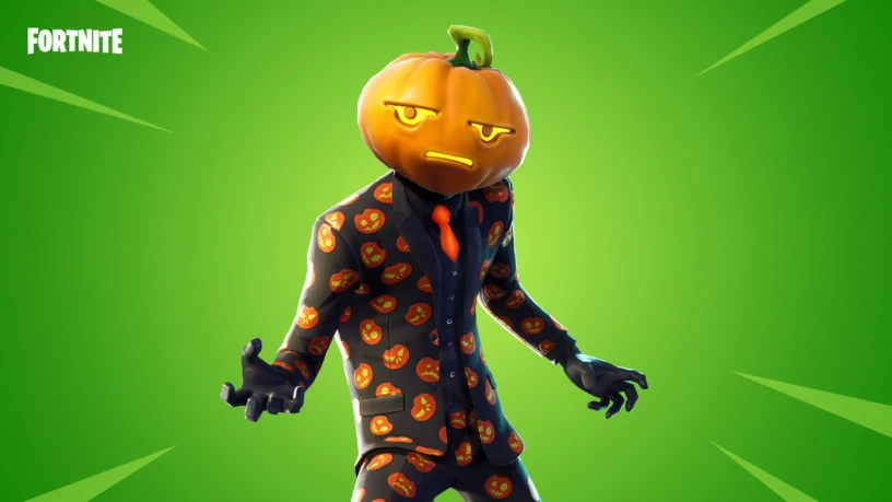 A man with a pumpkin head in a suit with a bunch of Pumpkins printed on it