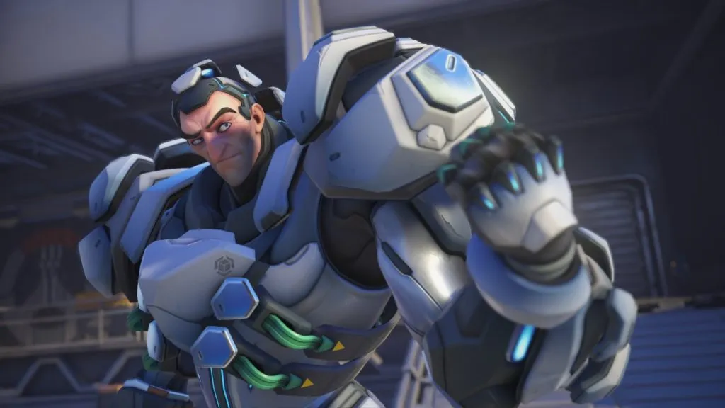 Sigma, a scientist, in his enhancement suit, clenching his fist at an enemy in Overwatch 2.