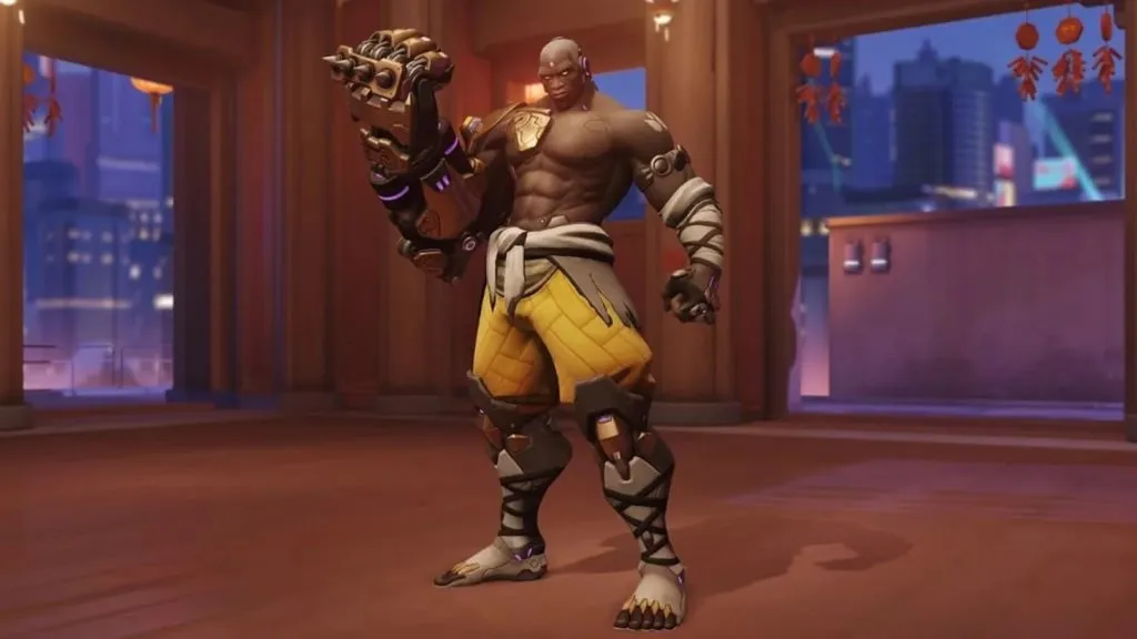 A screenshot of Doomfist holding up his big fist to the camera. What a macho man he is.
