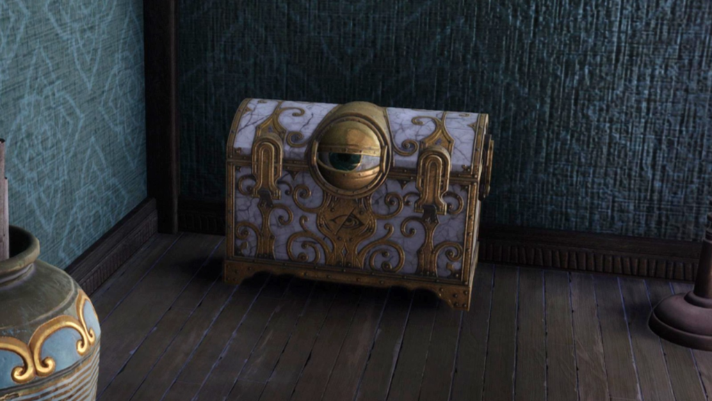 A screenshot of a chest that has an eyeball. It is white and golden. It is the Eyeball chest in Hogwarts Legacy.